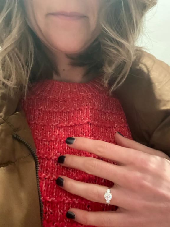 Oval diamond ring on hand
