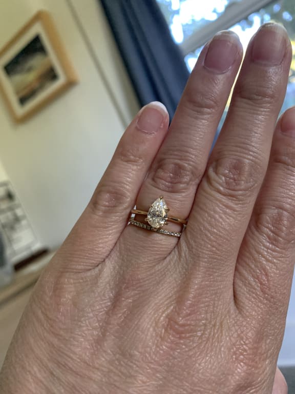 Oval diamond ring on hand