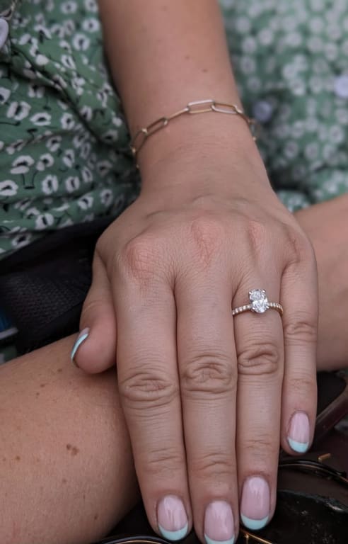 Oval diamond ring on hand