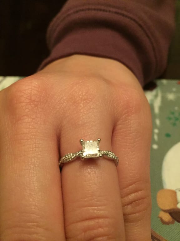 Oval diamond ring on hand