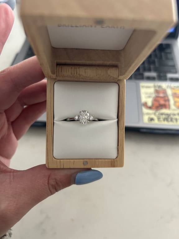 Oval diamond ring on hand