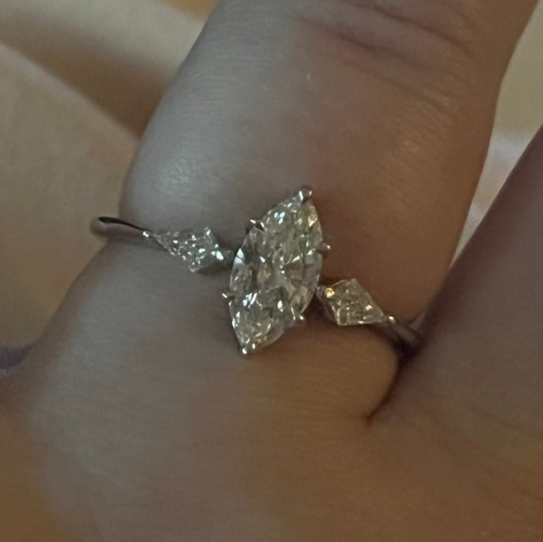 Oval diamond ring on hand