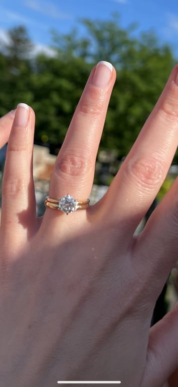 Oval diamond ring on hand