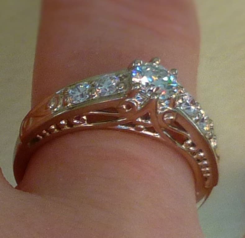 Oval diamond ring on hand