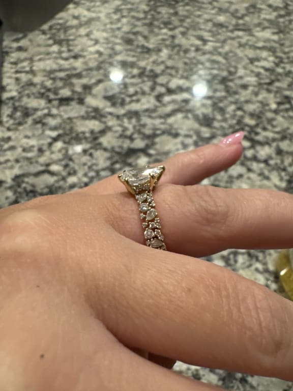 Oval diamond ring on hand