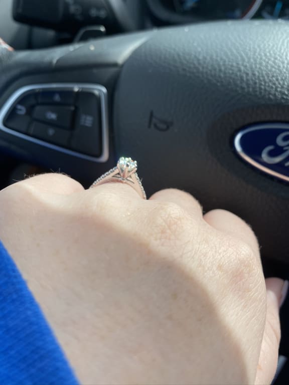 Oval diamond ring on hand