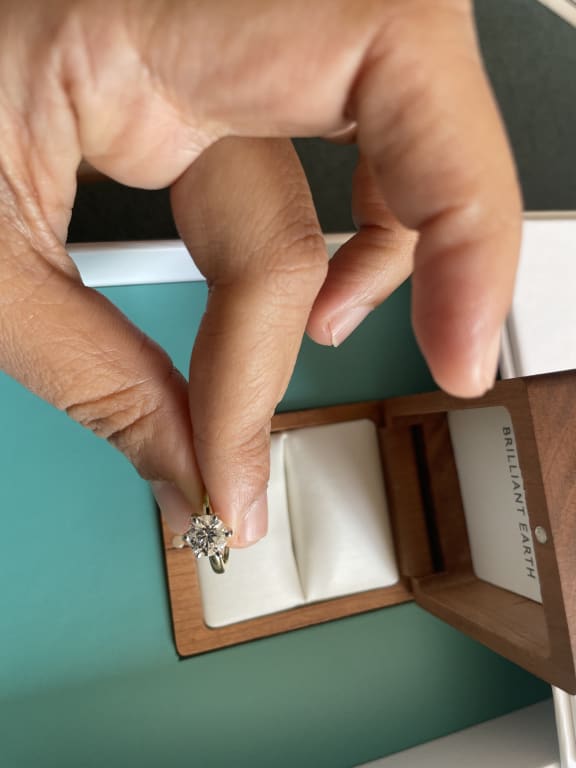 Oval diamond ring on hand