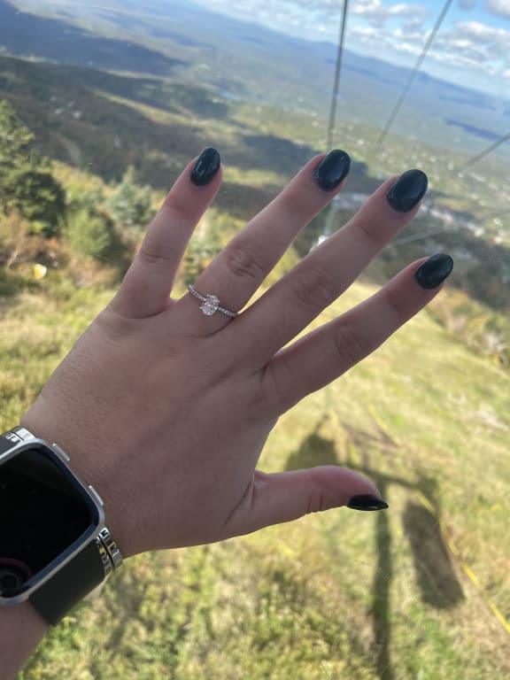 Oval diamond ring on hand