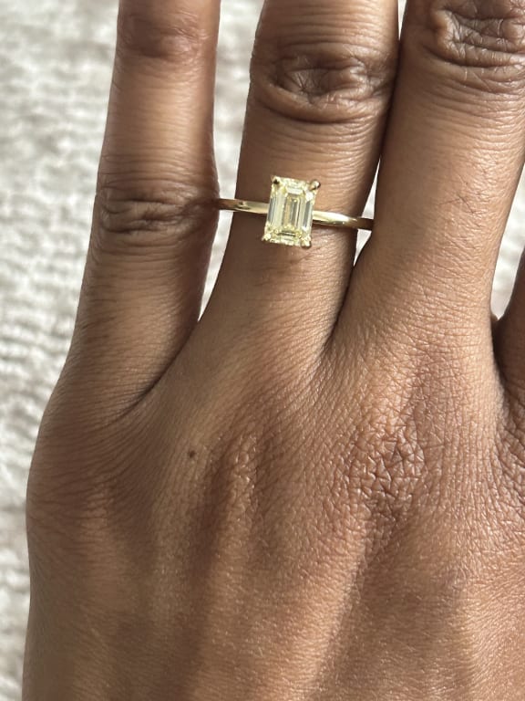 Oval diamond ring on hand