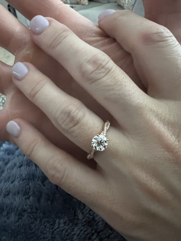 Oval diamond ring on hand