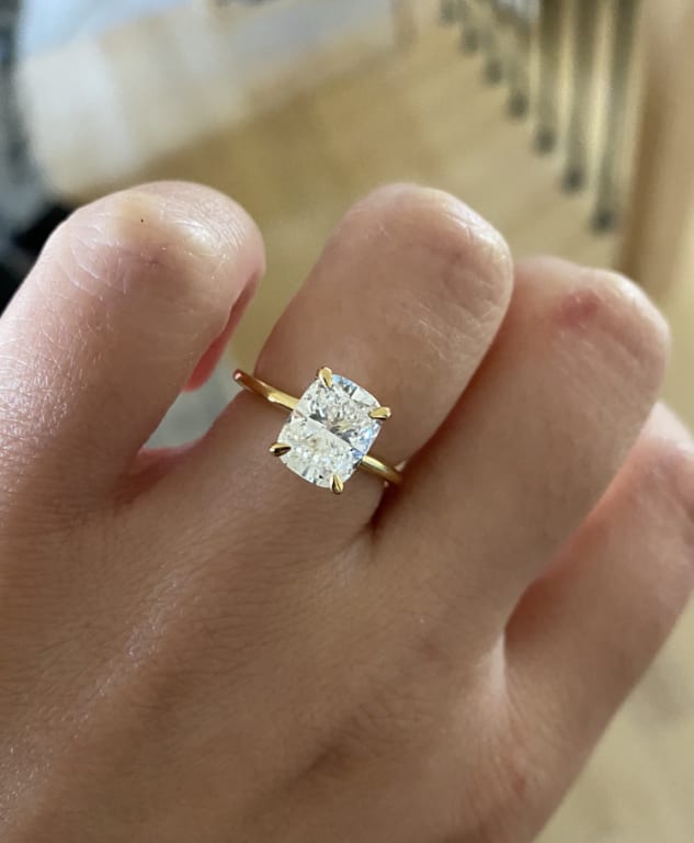 Oval diamond ring on hand