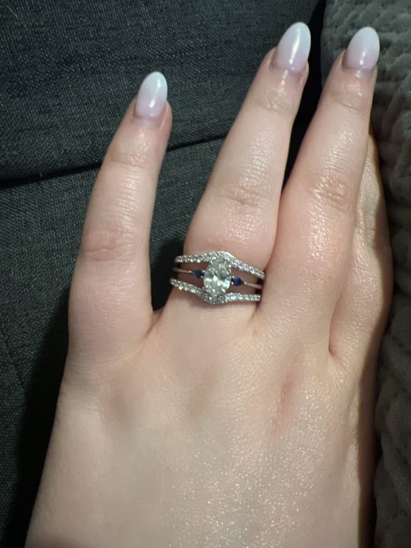 Oval diamond ring on hand