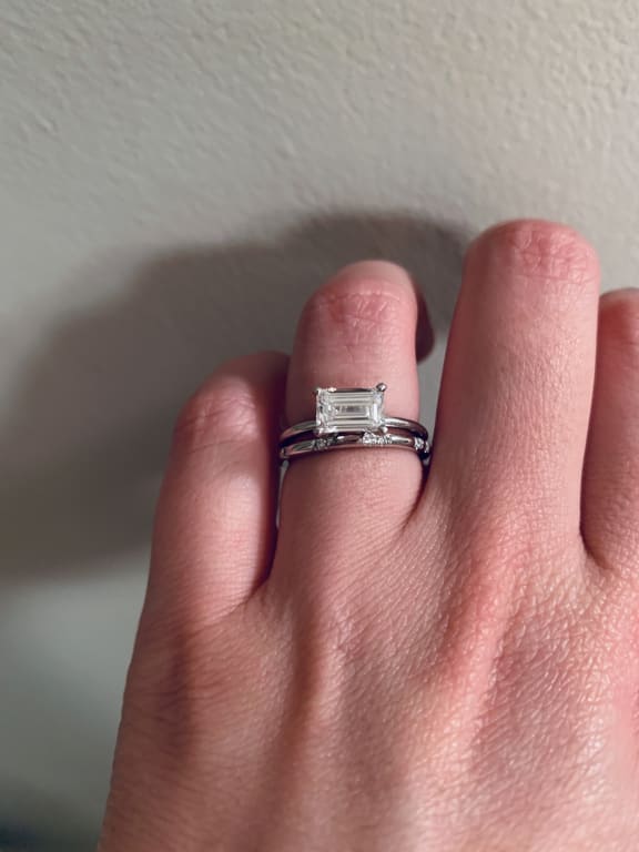 Oval diamond ring on hand
