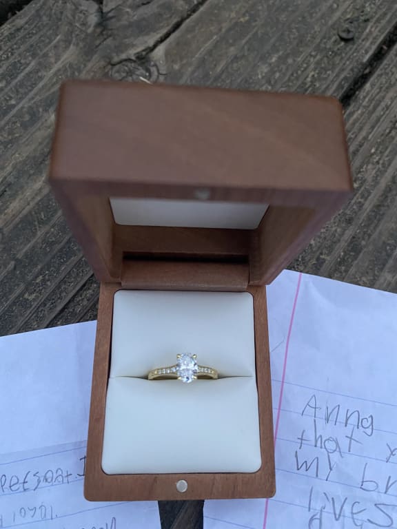 Oval diamond ring on hand