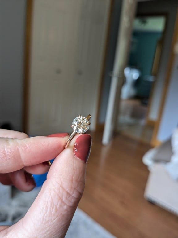 Oval diamond ring on hand