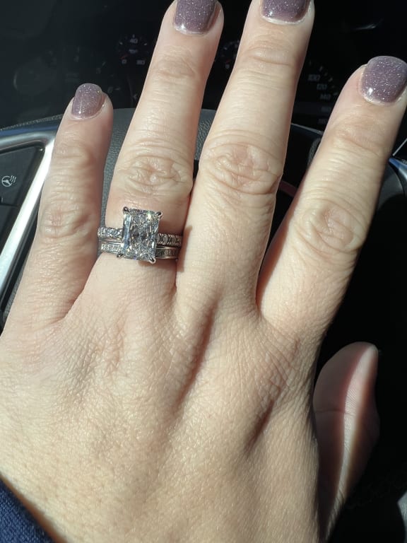 Oval diamond ring on hand