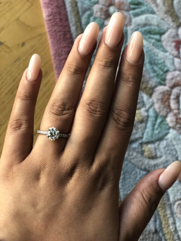 Oval diamond ring on hand
