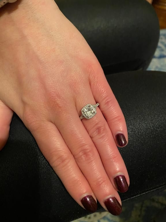 Oval diamond ring on hand