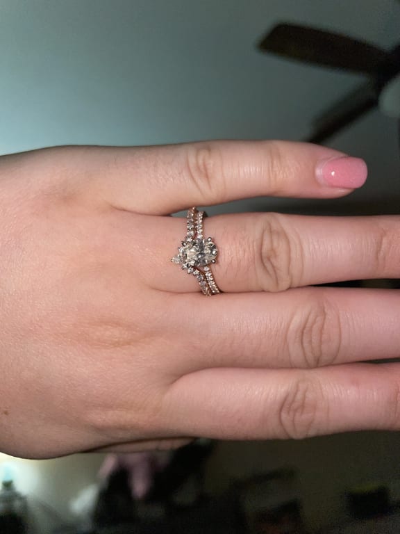 Oval diamond ring on hand