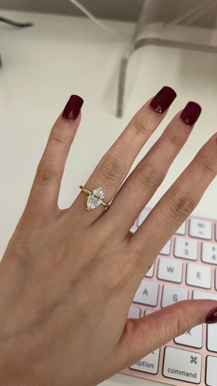 Oval diamond ring on hand