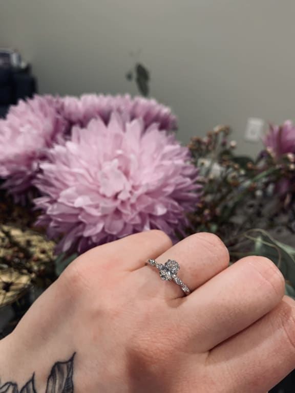 Oval diamond ring on hand