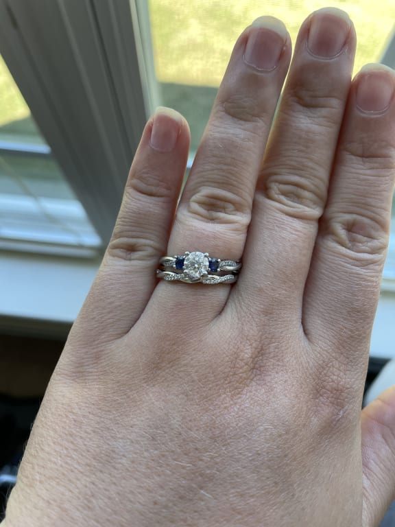 Oval diamond ring on hand