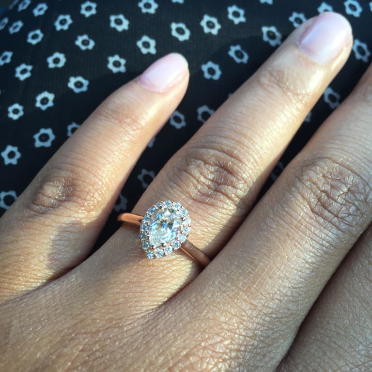 Oval diamond ring on hand