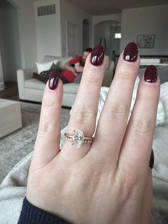 Oval diamond ring on hand