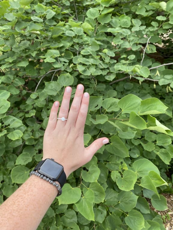 Oval diamond ring on hand