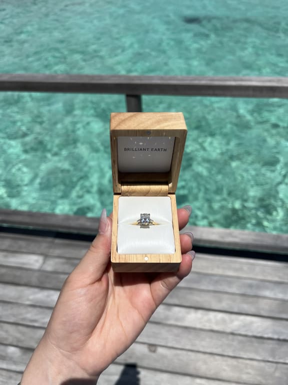 Oval diamond ring on hand