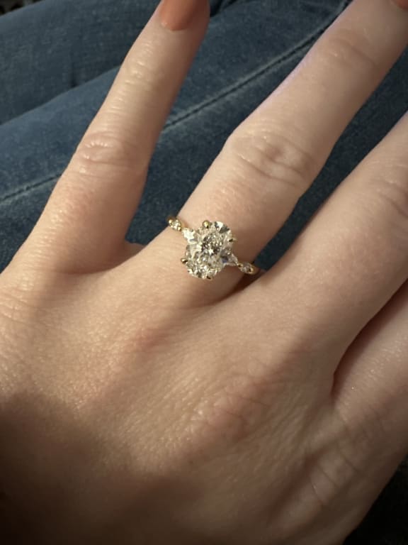 Oval diamond ring on hand