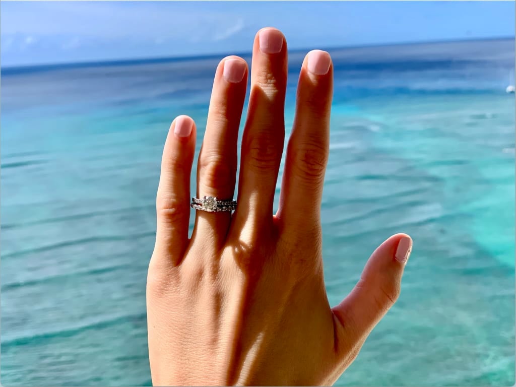 Oval diamond ring on hand