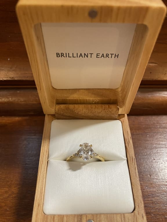 Oval diamond ring on hand