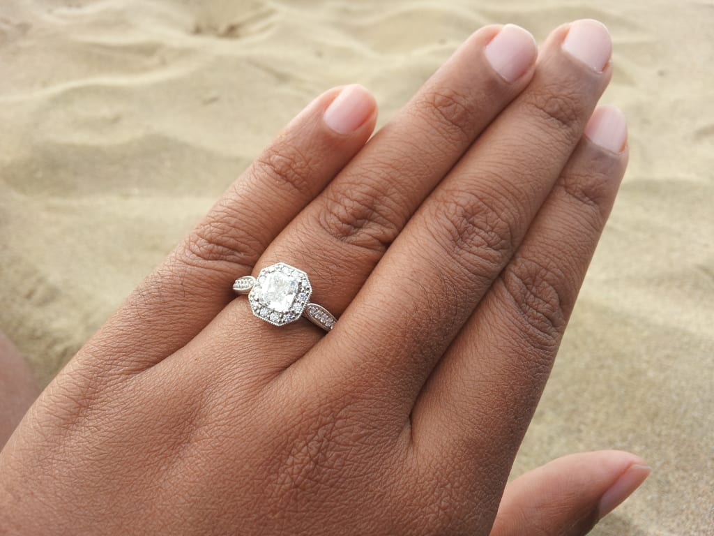 Oval diamond ring on hand