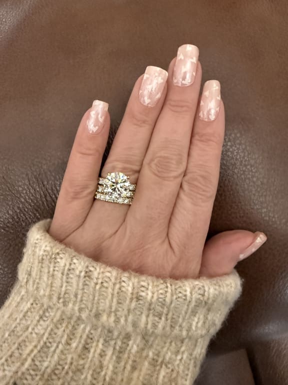 Oval diamond ring on hand