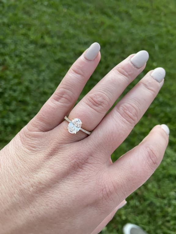 Oval diamond ring on hand