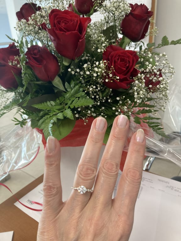 Oval diamond ring on hand