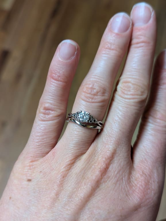 Oval diamond ring on hand