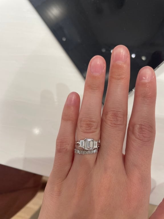 Oval diamond ring on hand