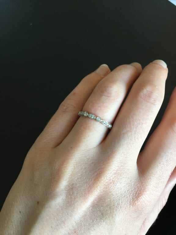 Oval diamond ring on hand