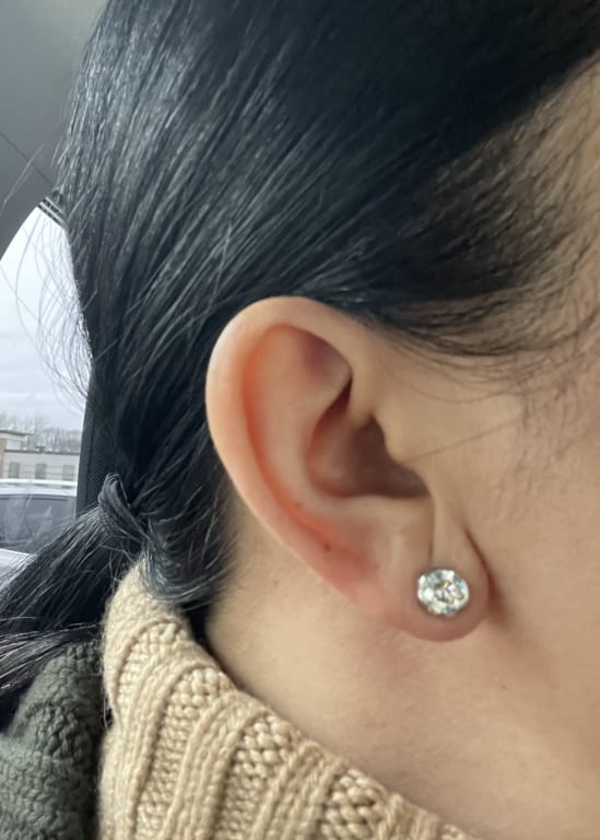Oval diamond ring on hand