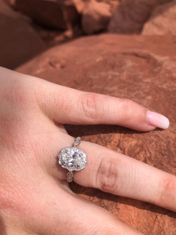 Oval diamond ring on hand