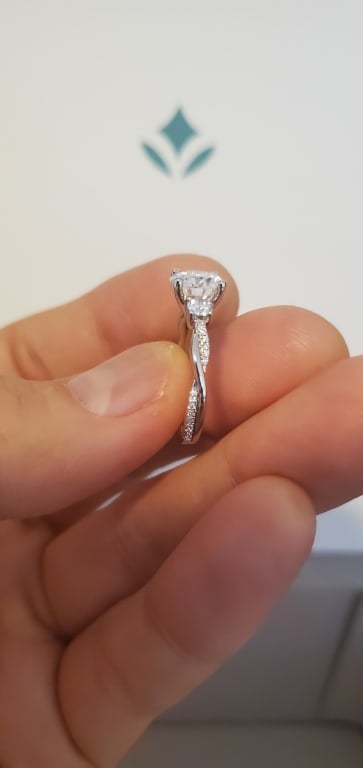 Oval diamond ring on hand