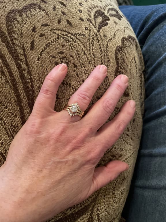 Oval diamond ring on hand