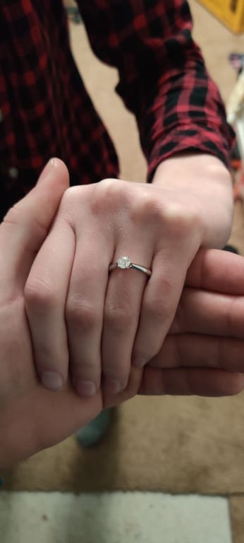 Oval diamond ring on hand