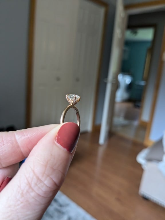 Oval diamond ring on hand