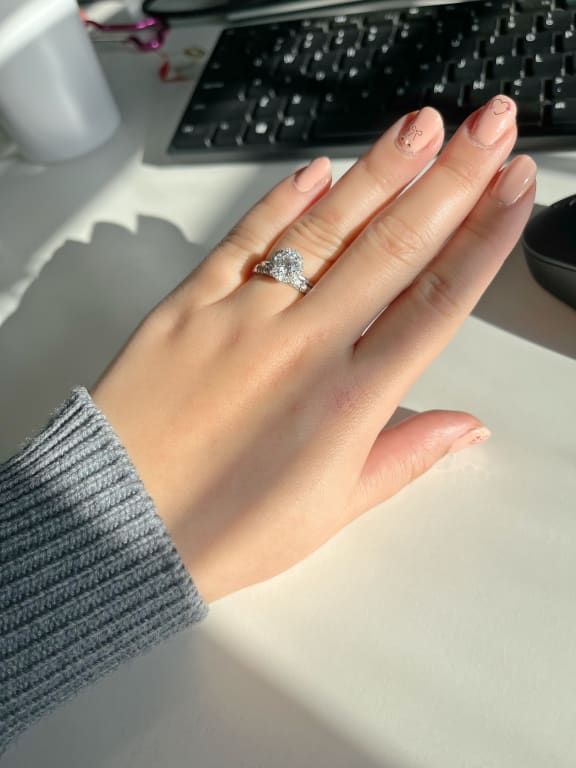 Oval diamond ring on hand