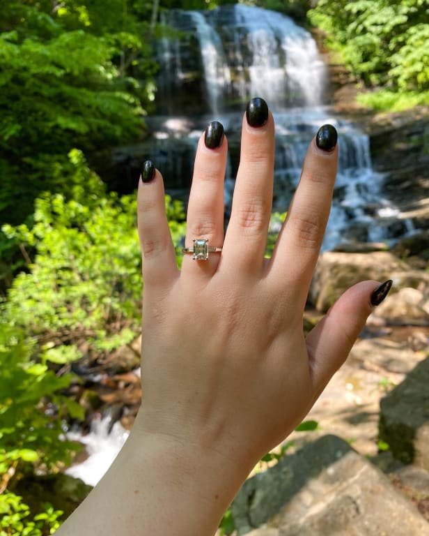 Oval diamond ring on hand