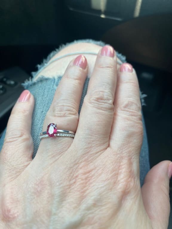 Oval diamond ring on hand