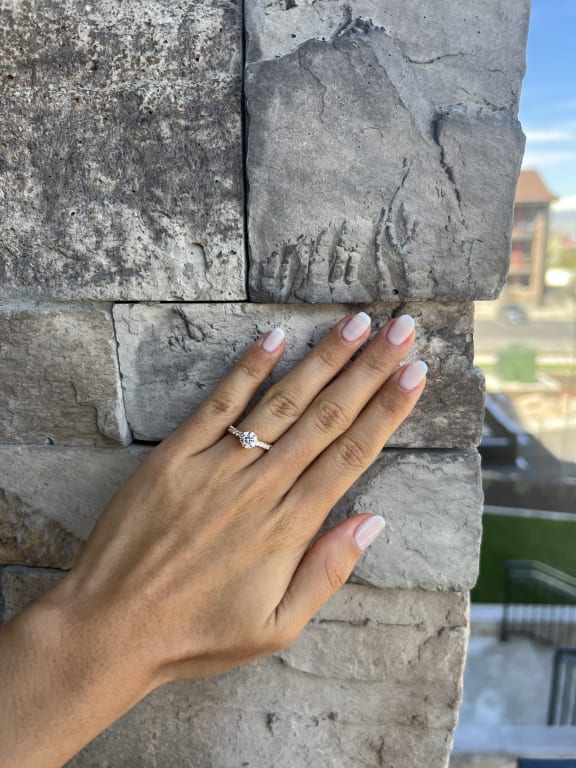 Oval diamond ring on hand